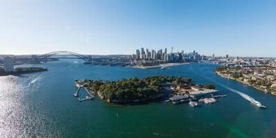 Sydney Harbour, Sydney Harbour Bridge and Sydney's city skyline, with Goat Island in the foreground