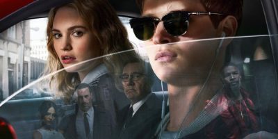 Promotional image for Baby Driver featuring Ansel Elgort and Lily James in a sports car, with Kevin Spacey, Jamie Foxx, Jon Hamm and Eiza González reflected in the car window.