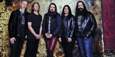 Five members of US rock group Dream Theater standing in a line