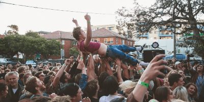 A man crowdsurfing at Sounds of the Suburbs festival