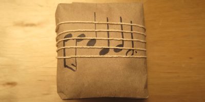 A gift wrapped in music-themed paper