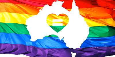 LGBT flag behind an outline of Australia