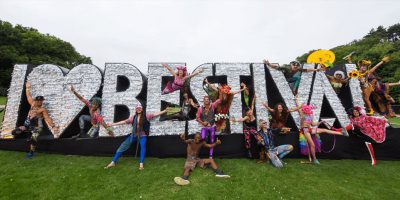 Fans gather around a sign that reads 'I Love Bestival'