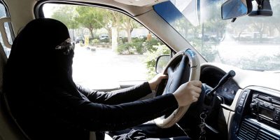 An image of a woman in Saudi Arabia driving