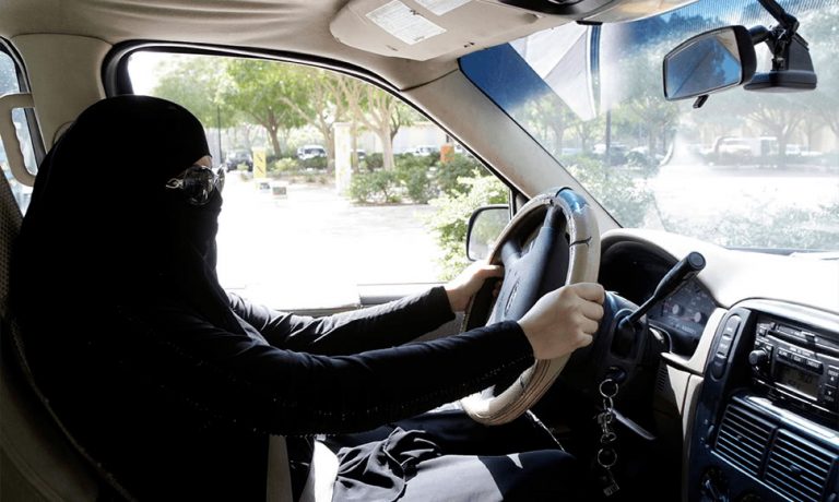 An image of a woman in Saudi Arabia driving