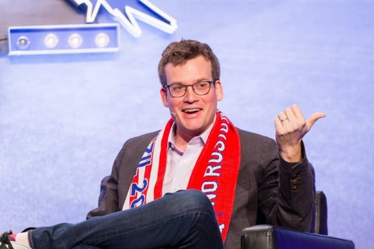 John Green in a scarf at a convention