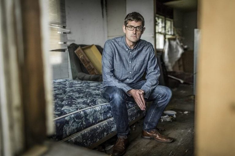 Louis Theroux on a bed