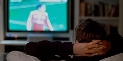 A person spending their time binge-watching TV