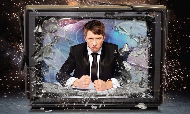 Newsreader Jonathan Pie smashes through a television