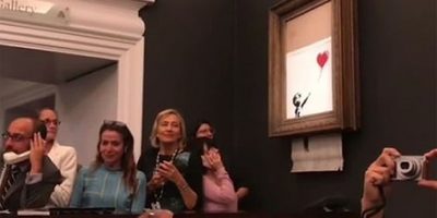 Image of Banksy's 'Girl With Balloon' being shredded