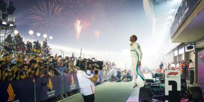 A victorious Lewis Hamilton celebrates in parc ferme after winning the Formula 1 2018 Singapore Grand Prix