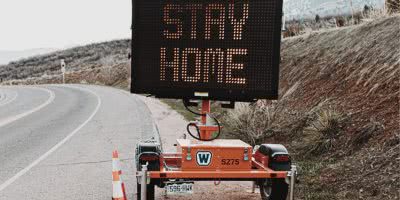 Road sign telling people to stay home in the midst of COVID-19