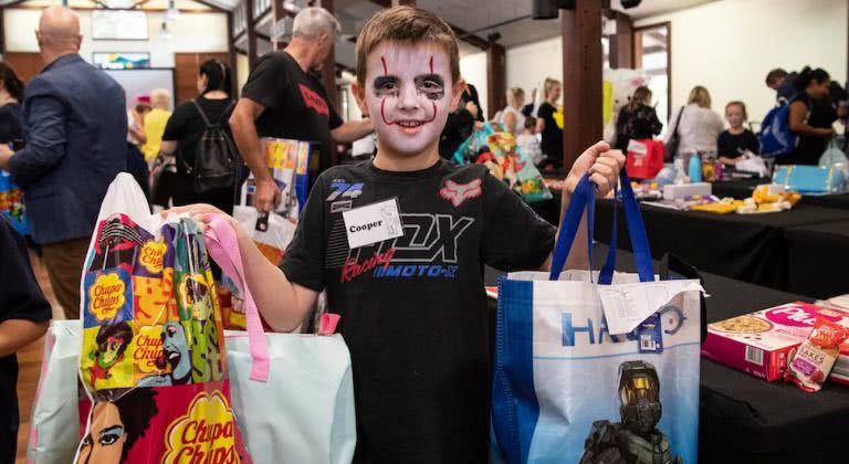 Boy holds Easter Show Bags