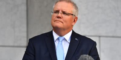 An activist claims he was detained for trying to ask Scott Morrison a question