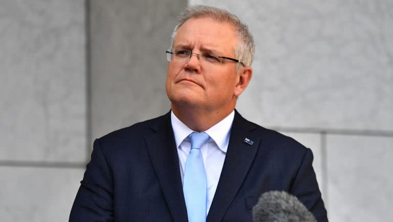 An activist claims he was detained for trying to ask Scott Morrison a question