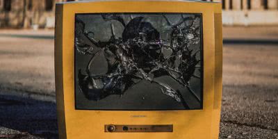 Broken television on the concrete, TVs