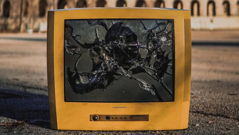 Broken television on the concrete, TVs