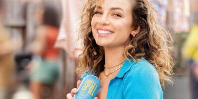 Abbie Chatfield holding her beer