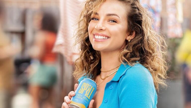 Abbie Chatfield holding her beer