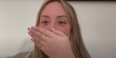 Charlotte Crosby covers mouth with hand