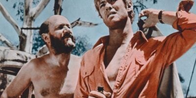 Donald Pleasence and Gary Bond in a lobby card for Wake in Fright (1971).