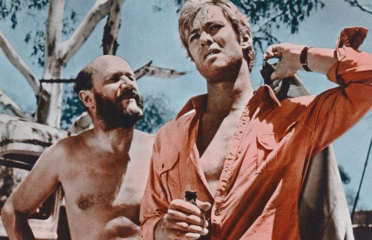 Donald Pleasence and Gary Bond in a lobby card for Wake in Fright (1971).