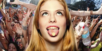 Crowd with their hands in the air, insert of girl in the middle of the picture with a lollie on her tongue