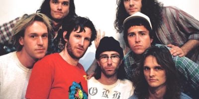 King Gizz band members standing in a group looking at the camera