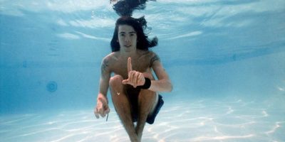 Dave Grohl under water pointing his finger up