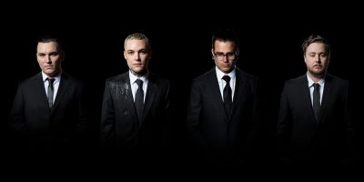 The Amity Afflcition dressed in suits