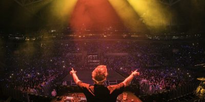 A DJ in front of a crowd