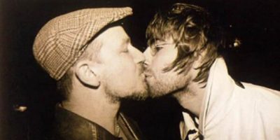 Bono and Liam Gallagher kissing in 1996