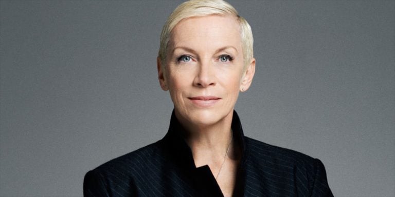 Singer Annie Lennox against a grey background