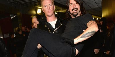 Queens Of The Stone Age's Josh Homme carrying Foo Fighters' Dave Grohl