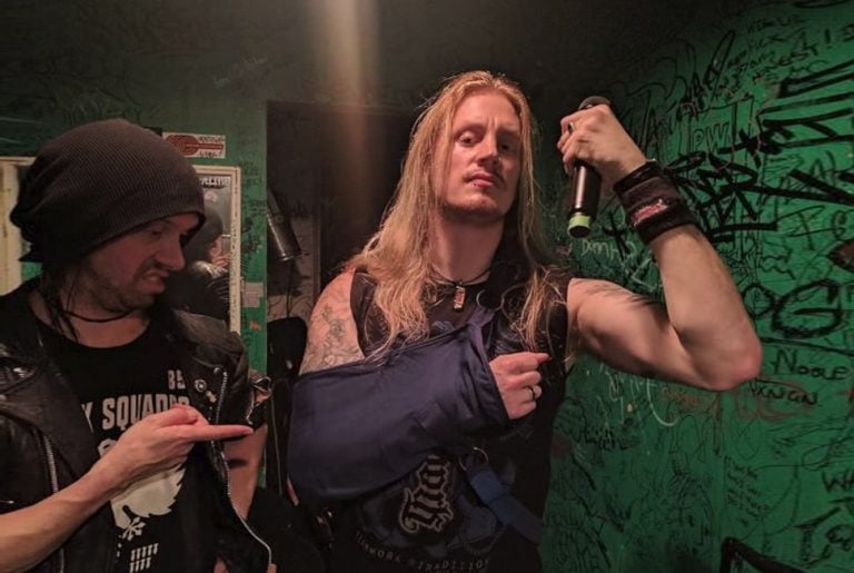 Dragonforce frontman Marc hudson in a sling