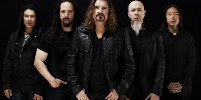 The five members of US rock group Dream Theater standing in a line