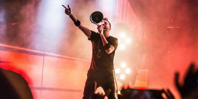 Rise Against frontman onstage with a megaphone