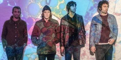 All four members of US Allah-Las with a trippy light show in the foreground