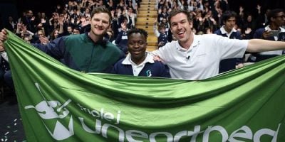 Unearthed High winner Arno Faraji being congratulated by triple j's Ben & Liam