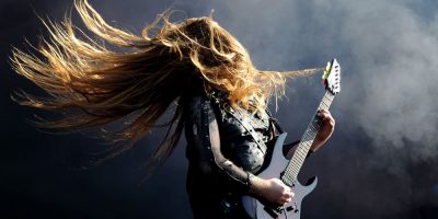 A metal guitarist rocking out onstage