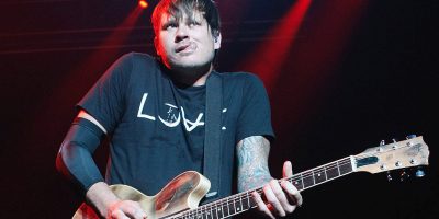 Tom DeLonge playing guitar