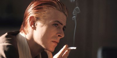 A young David Bowie smokes a cigarette