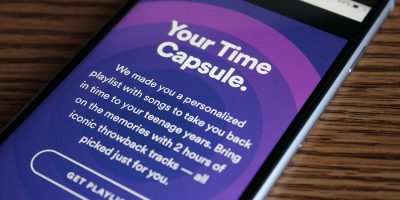 Image of a phone using Spotify and its 'Time Capsule' service