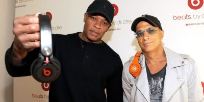 Dr Dre and Jimmy Iovine holding up Beats headphones