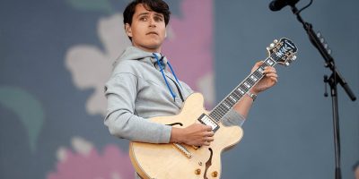 Vampire Weekend's Ezra Koenig performing live