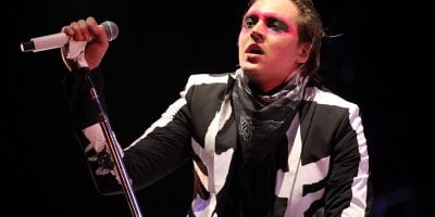Arcade Fire's Win Butler performing live