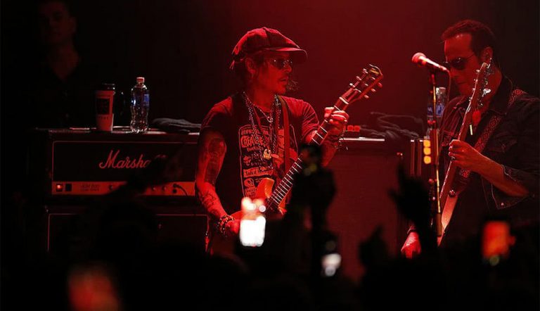 Johnny Depp performing with Stone Temple Pilots guitarist Robert DeLeo