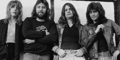 Ozzy Osbourne with former bandmates, including Bob Daisley, right.