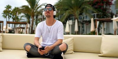 German DJ Robin Schulz wearing a pair of his limited edition Sennheiser headphones