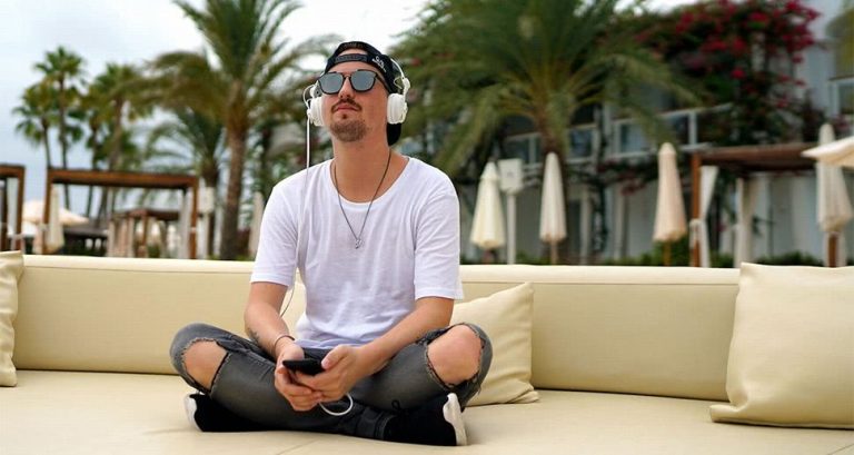 German DJ Robin Schulz wearing a pair of his limited edition Sennheiser headphones